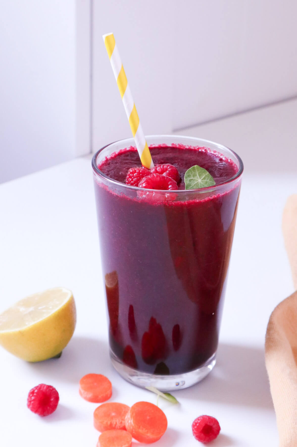 Beet smoothie in a tall glass. 