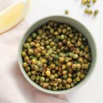 Salted garlic crunchy roasted peas in a bowl.