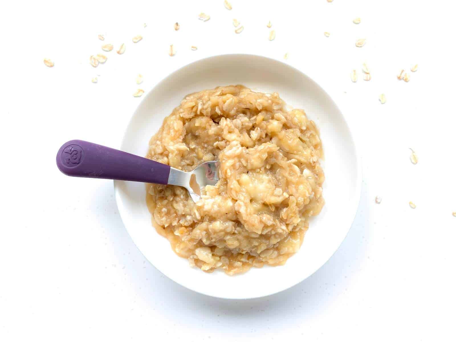 apple banana oatmeal with spoon 