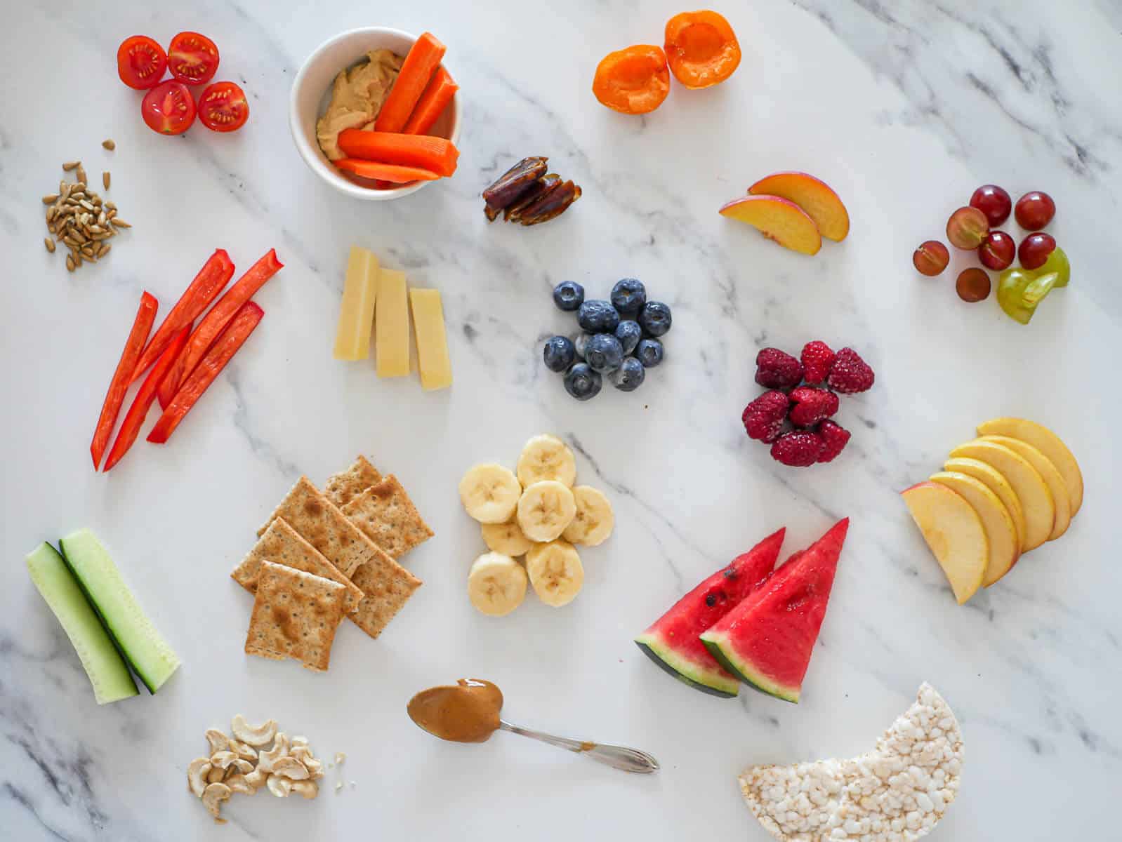 easy healthy snacks for toddler scattered on a marble background 