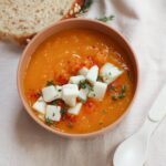 Roasted Butternut Squash and Carrot Soup in a bowl topped with feta