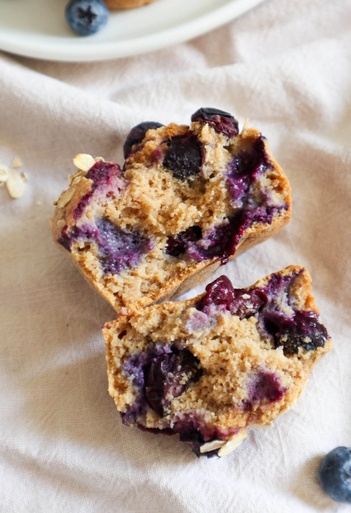 Halved vegan blueberry oatmeal muffin