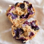 Halved vegan blueberry oatmeal muffin.