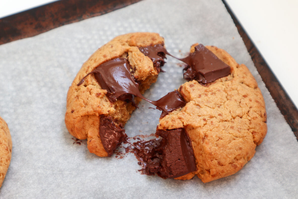 cookie broken in half with melted chocolate chunks in between