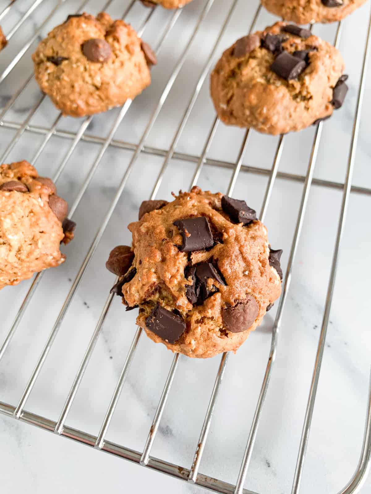 Healthy chocolate chip cookies on a stainless steel rack