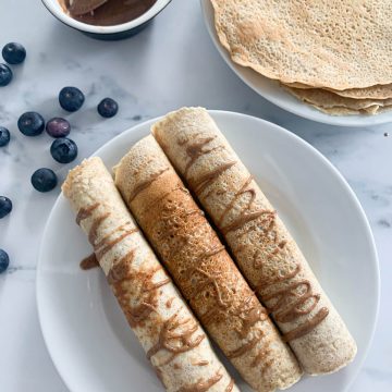 wholewheat dairy free crepes rolled and covered with peanut butter