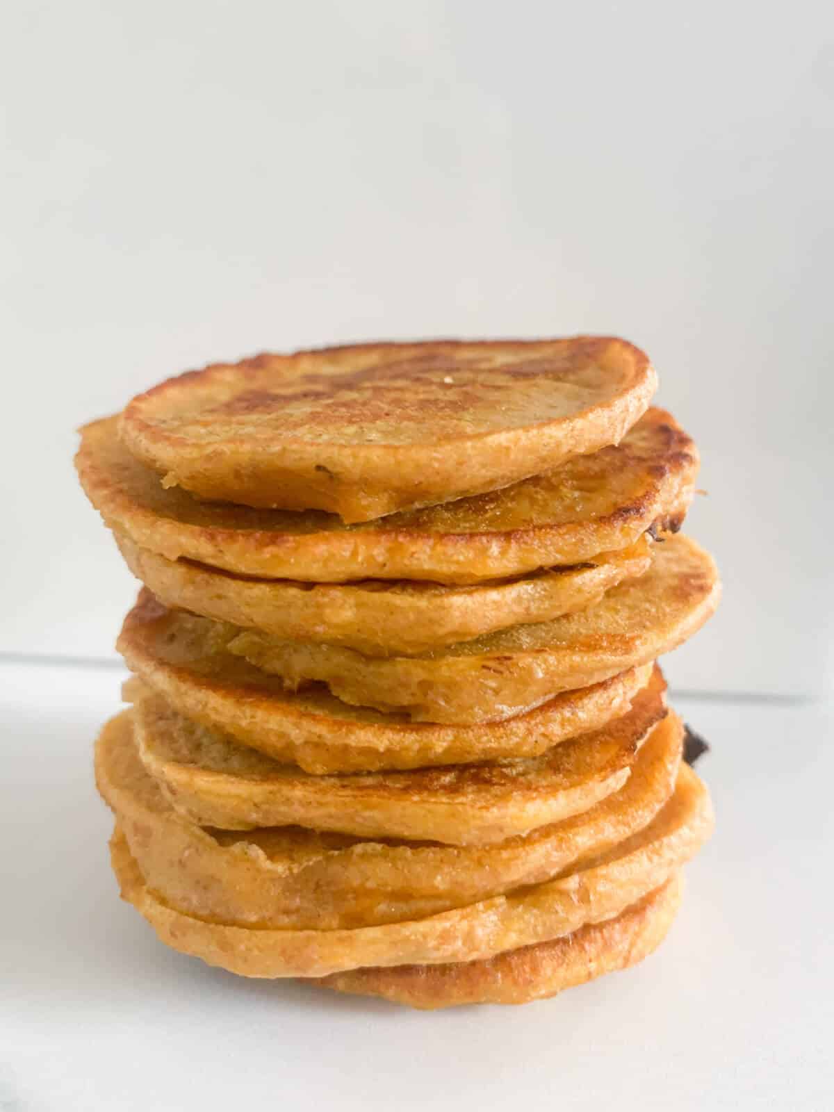 Stack of sweet potato pancakes with white background