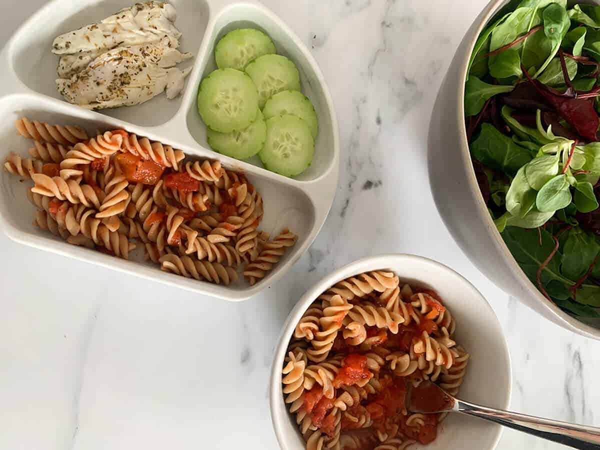 mom pasta plate and toddler plate with cucumber, sea bass and pasta with homemade pasta sauce