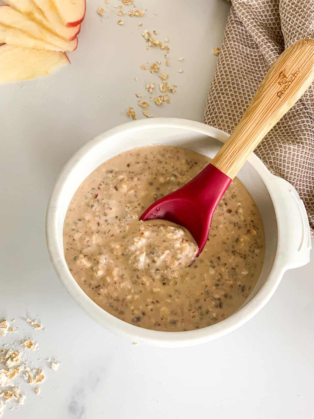 Oatmeal with a silicone baby spoon in it