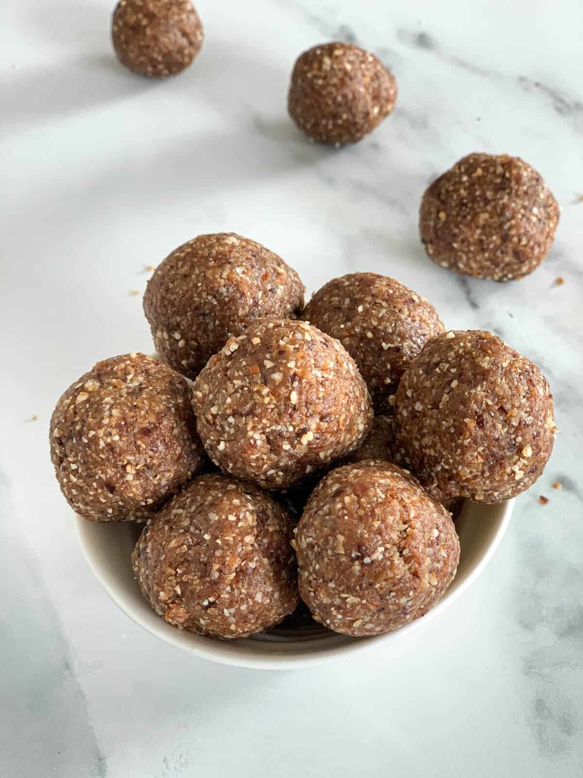Energy balls for toddlers piled up in a bowl