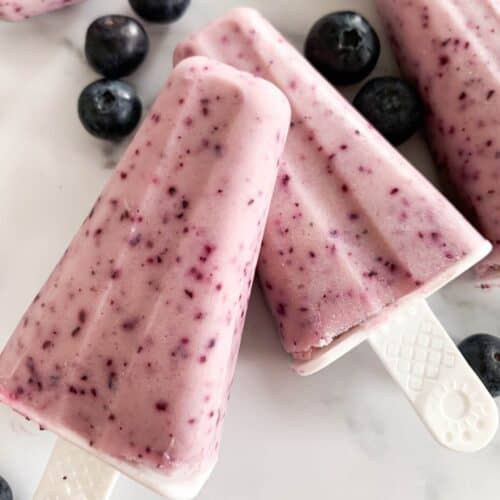 2 frozen blueberry yogurt popsicles