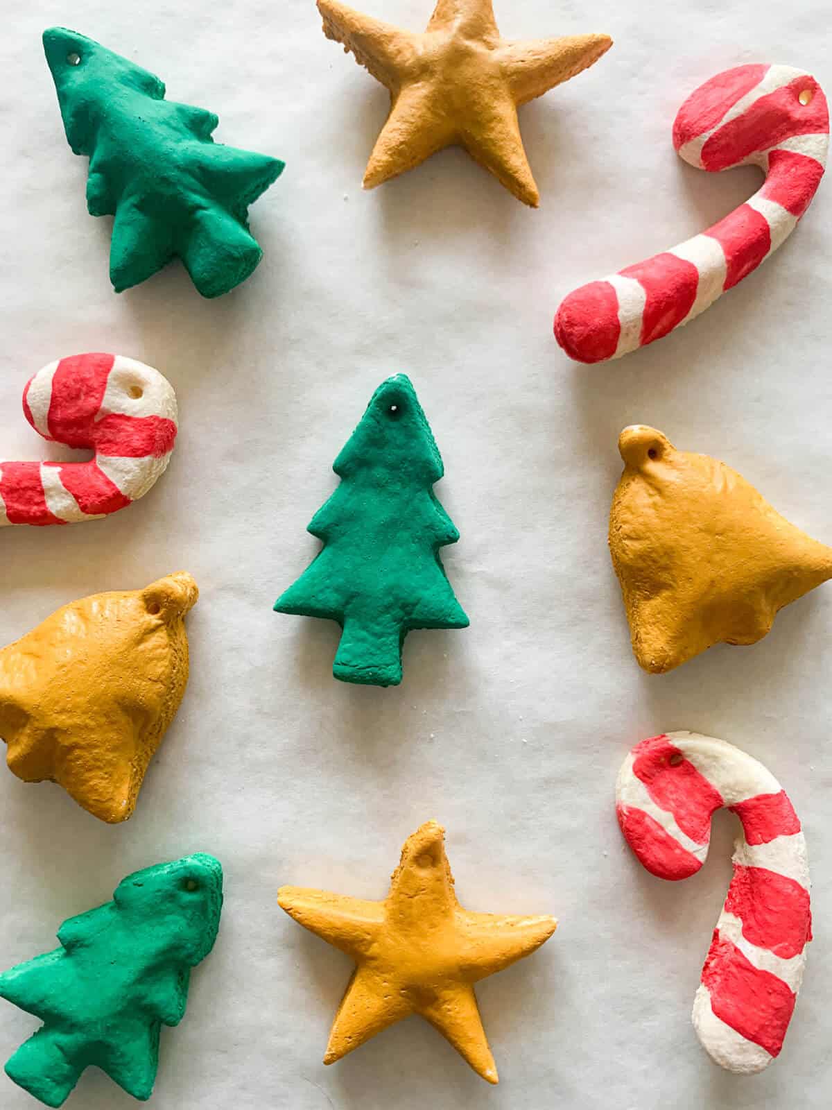 Decorated salt dough christmas ornaments - lollipops, christmas trees, stars and bells
