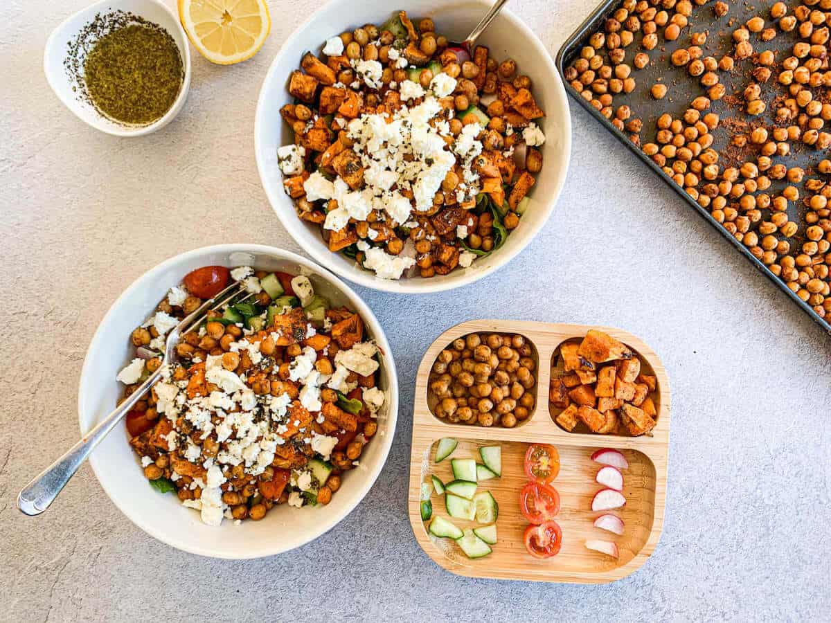 2 bowls of Mediterranean sweet potato salad with lemon mint vinaigrette and 1 plate for toddler 