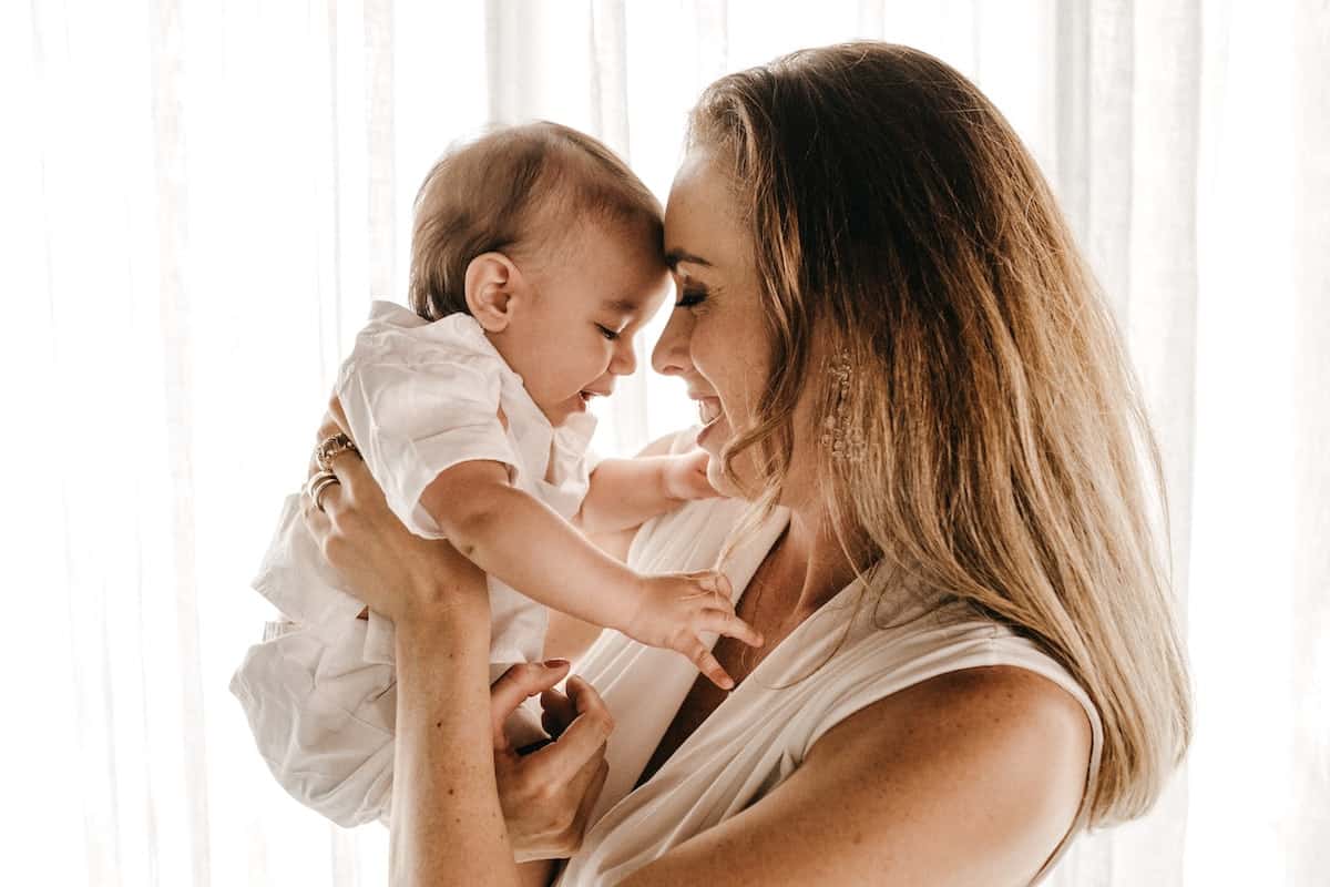 mom holding baby