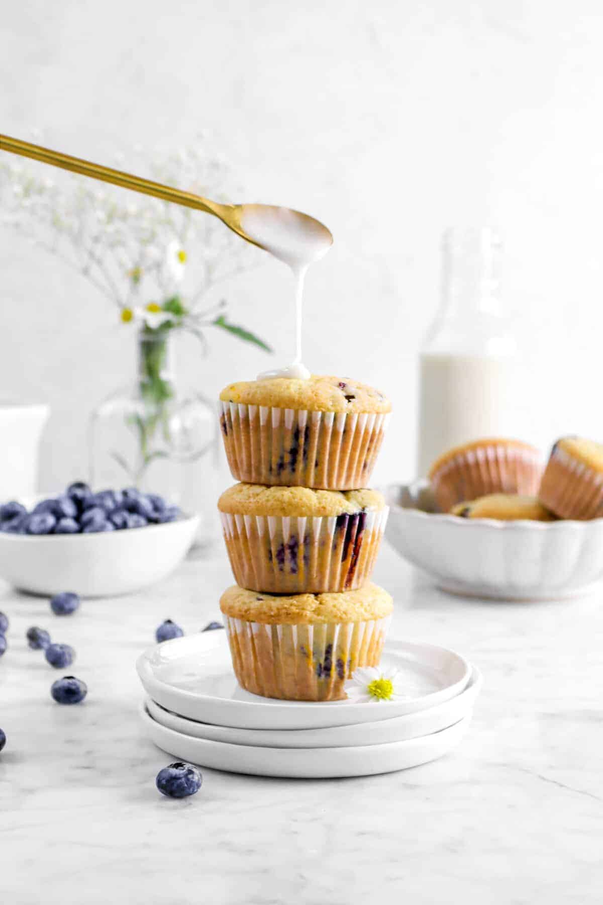 3 vegan blueberry muffins stacked 