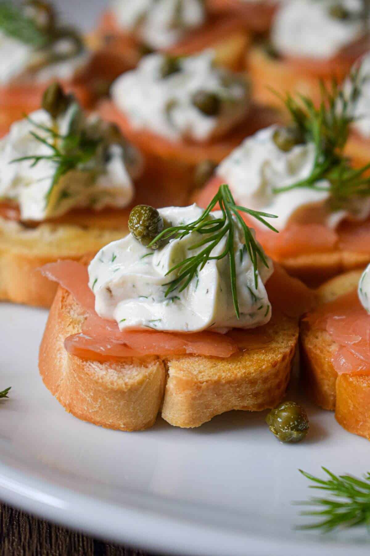 small bread slice with smoked salmon, cream cheese and capers