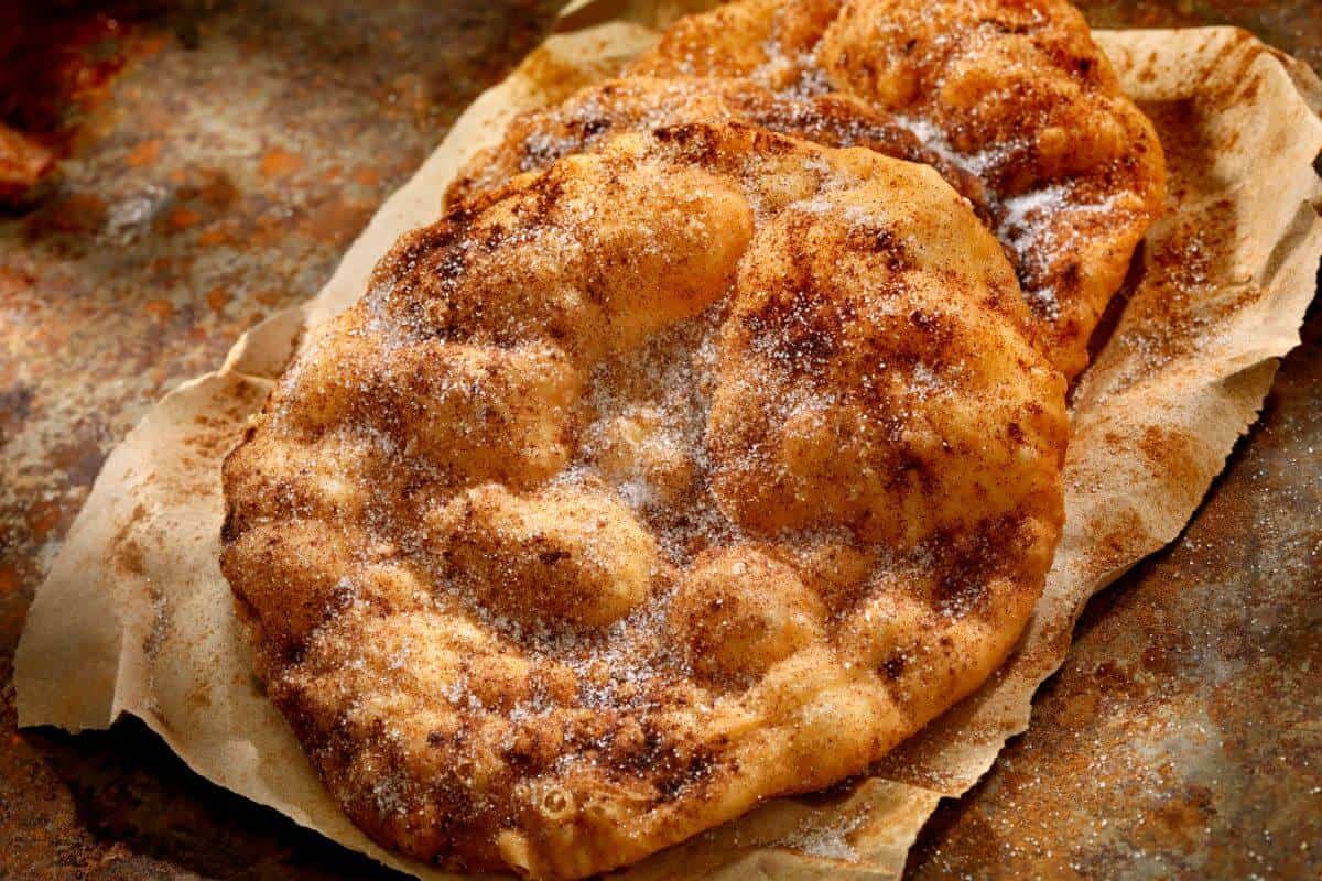 2 pastry elephant ears, dusted with sugar 