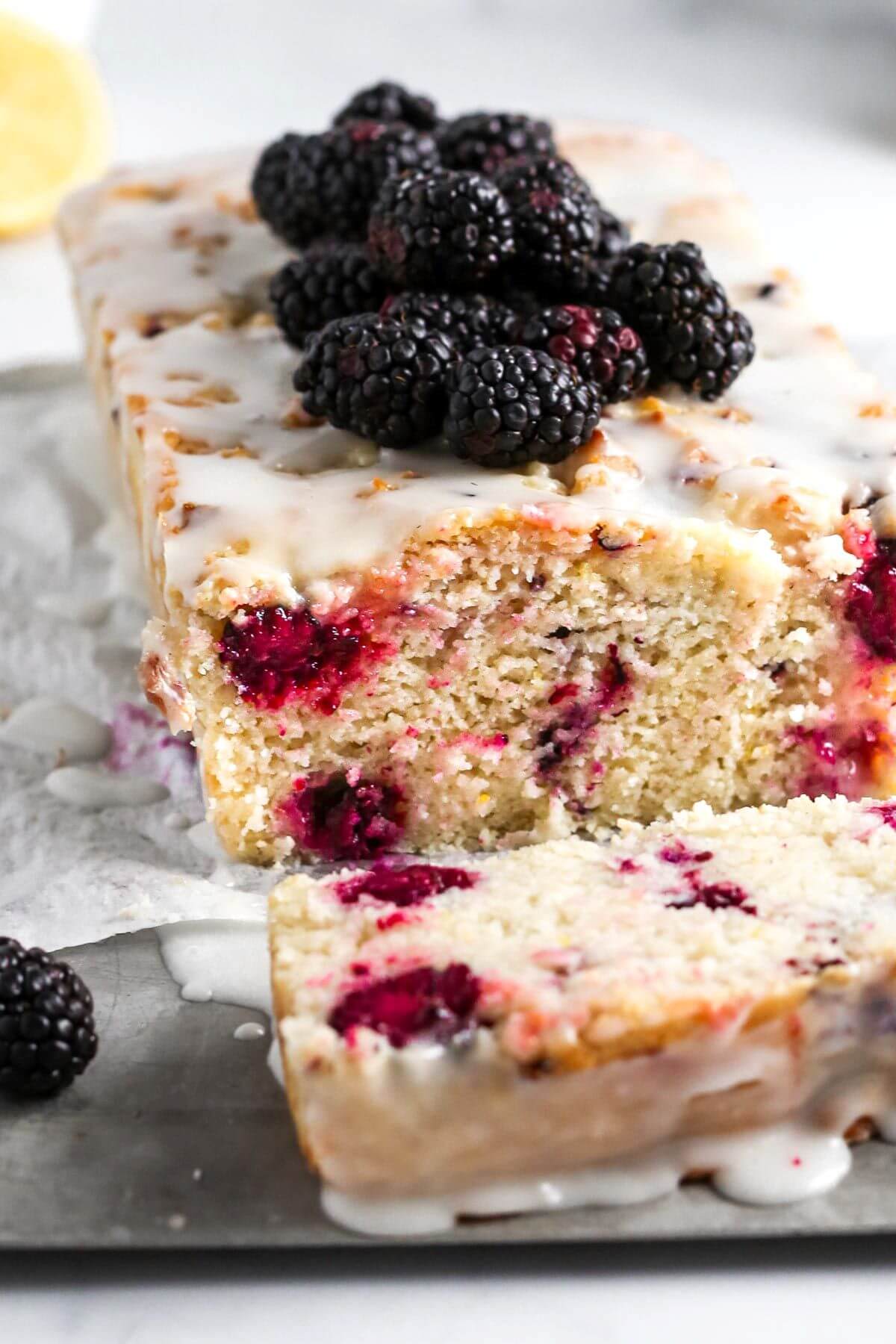 Blackberry loaf with some blackberries on top. 