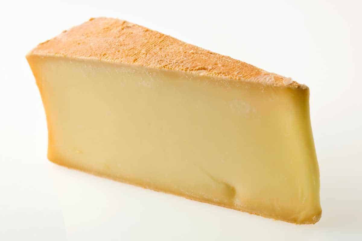A wedge of abondance cheese