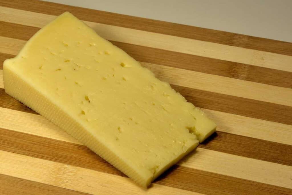 A wedge of asiago cheese