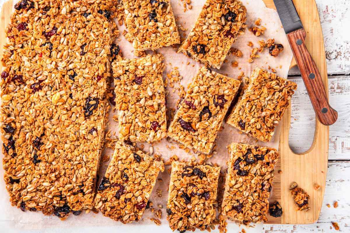Some homemade granola bars partially cut up to be ready as beach snacks