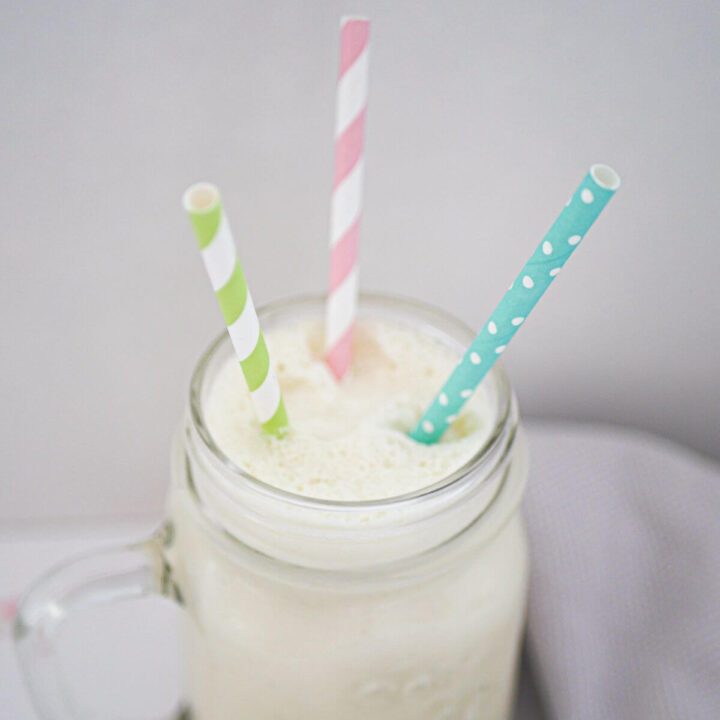 top down view of coconut shake with three straws