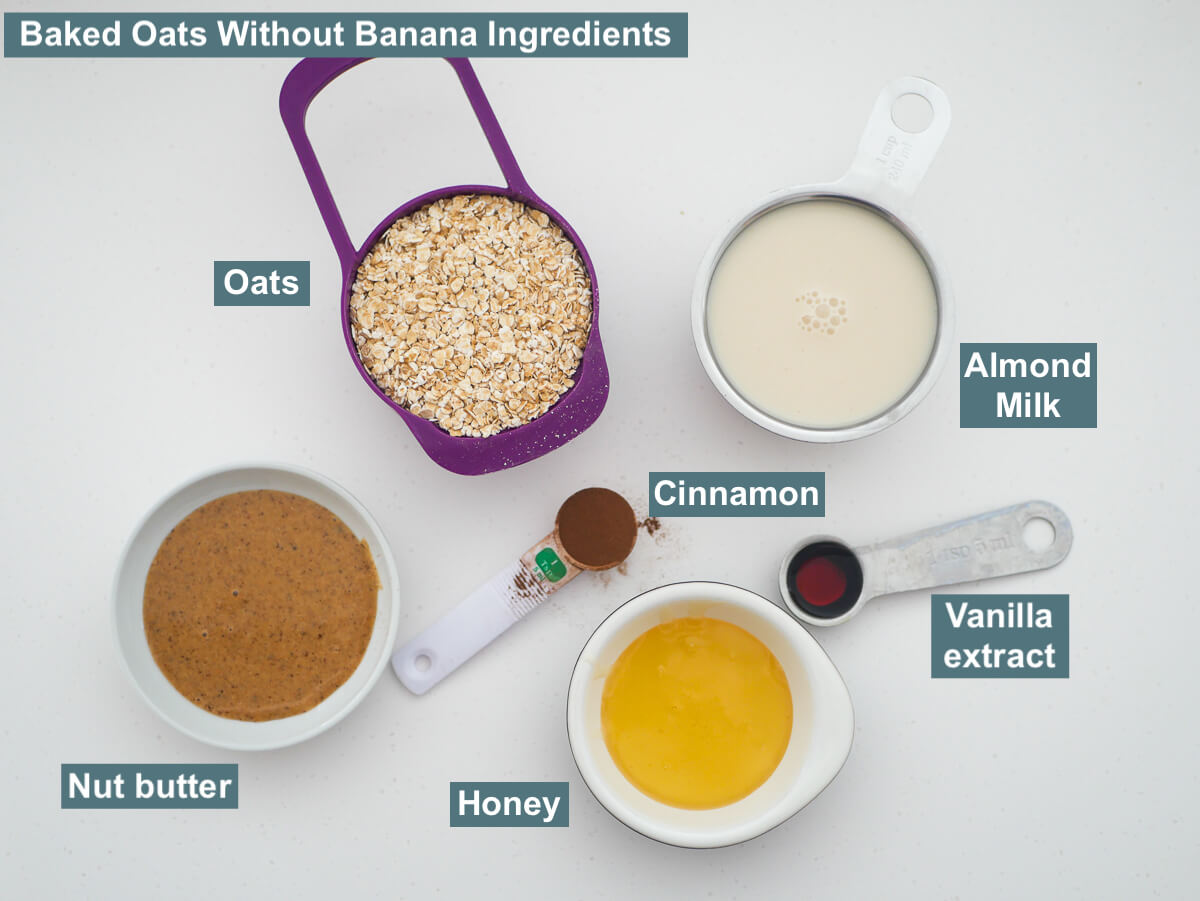 ingredients on white background labelled - oats, almond milk, honey, cinnamon, vanilla extracts and nut butter