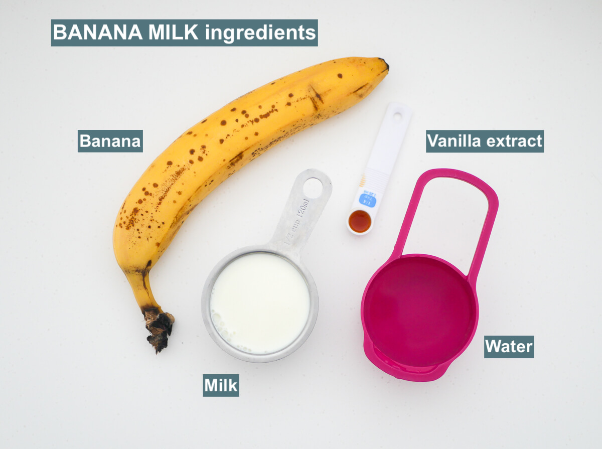 ingredients on white background - banana, milk, water, vanilla extract