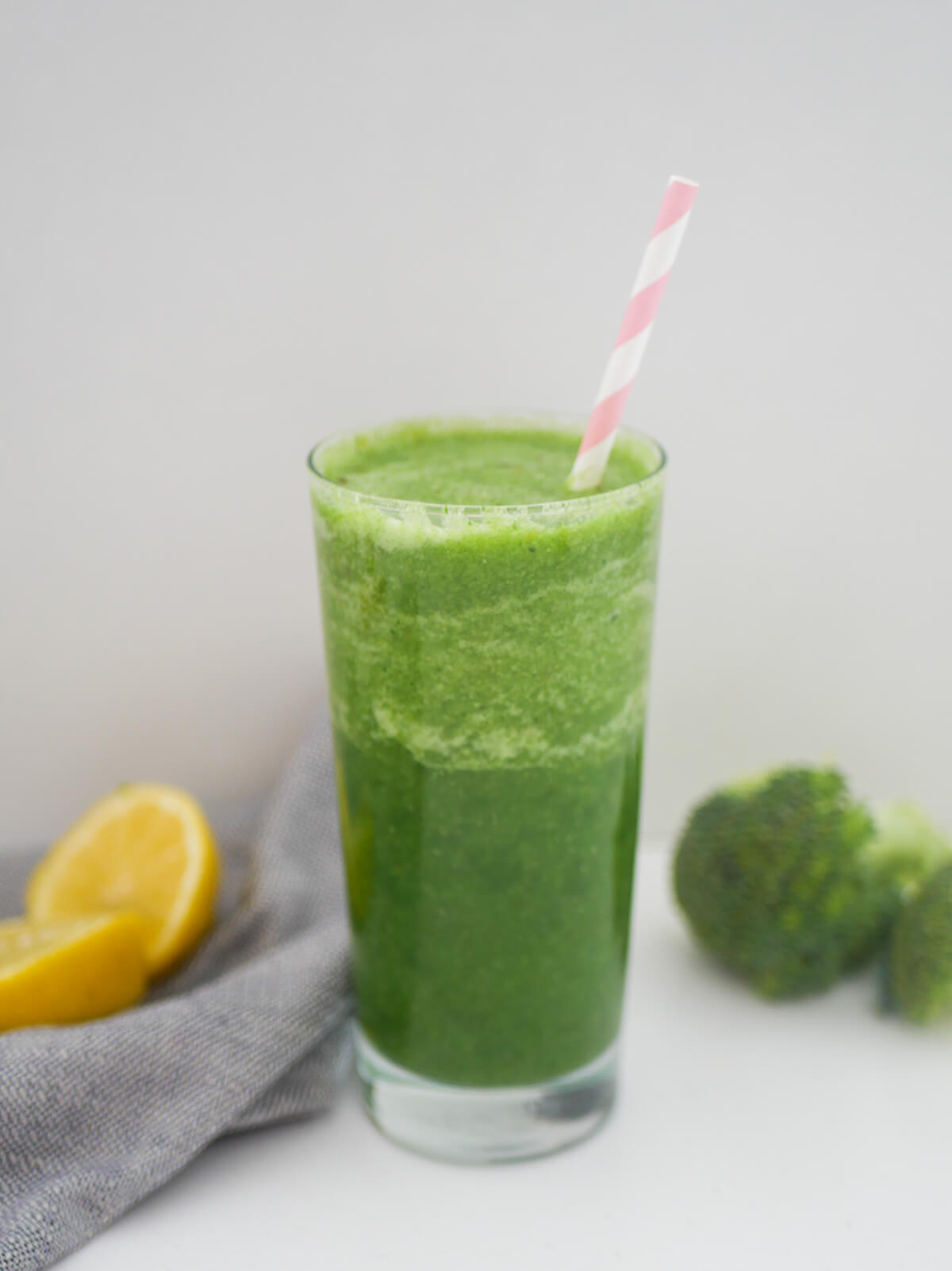 green smoothie in a tall glass