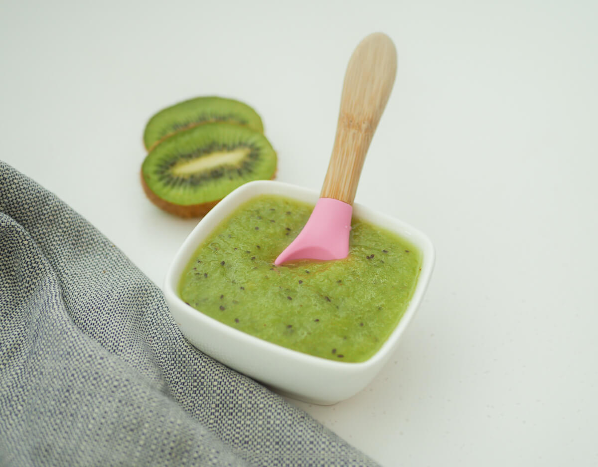 kiwi puree with a spoon dipped in