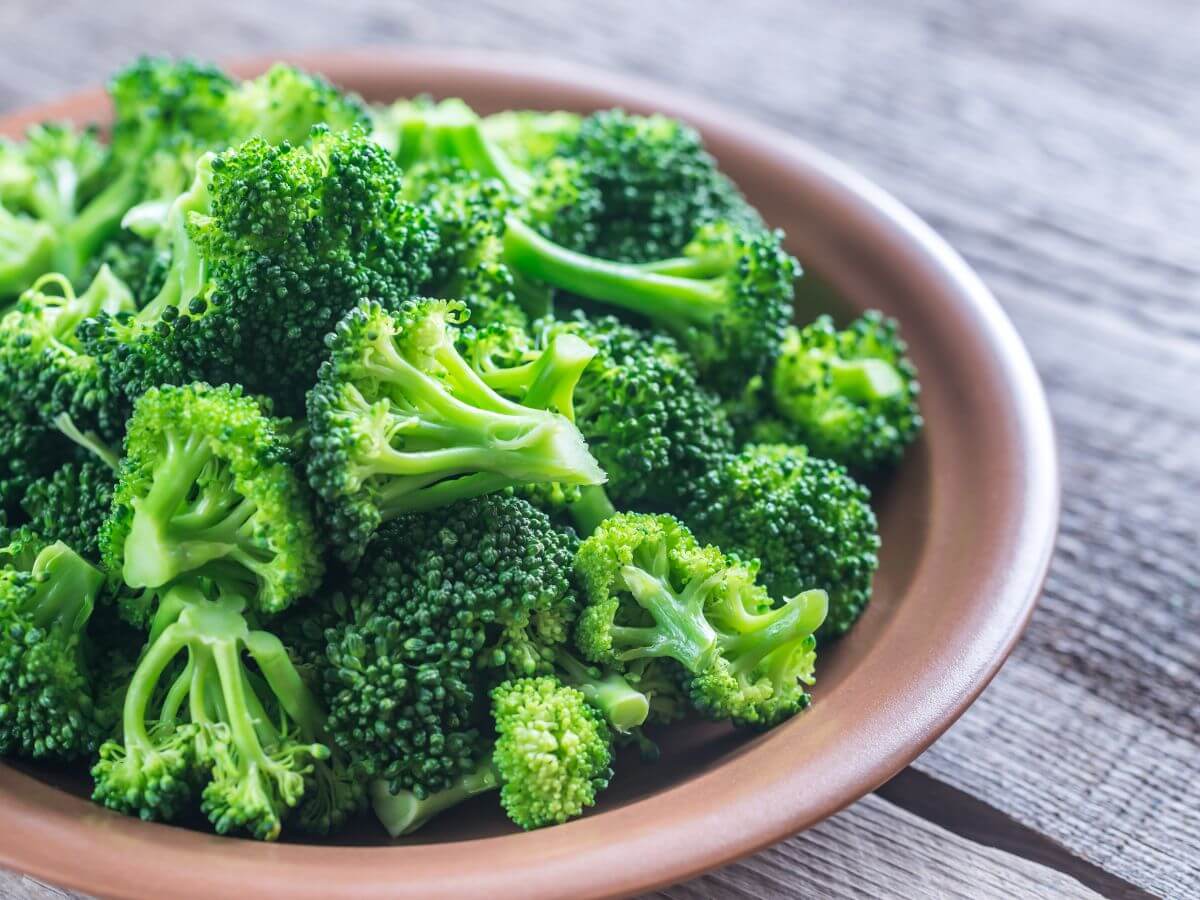 uncooked broccoli florets on a plate