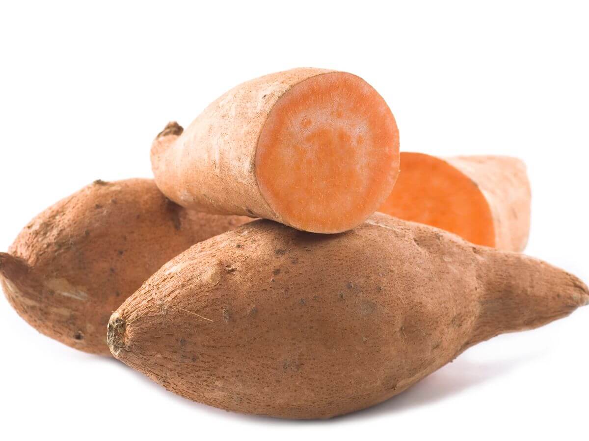 Raw Sweet Potatoes on white background 