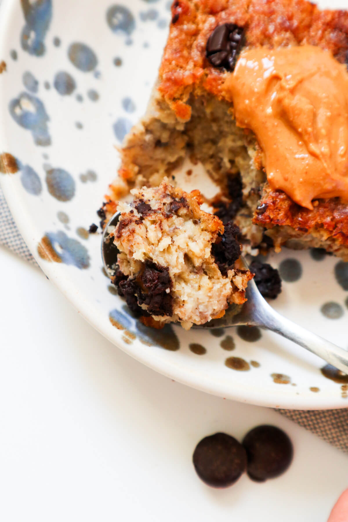 Spooned out baked oatmeal with chocolate chips.