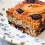 Close up of slice of baked oatmeal with chocolate chips.