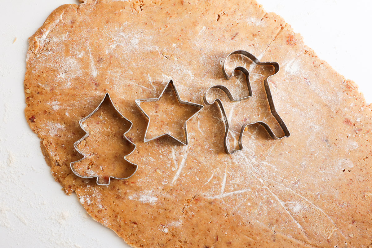 Cookie cutters on dough.