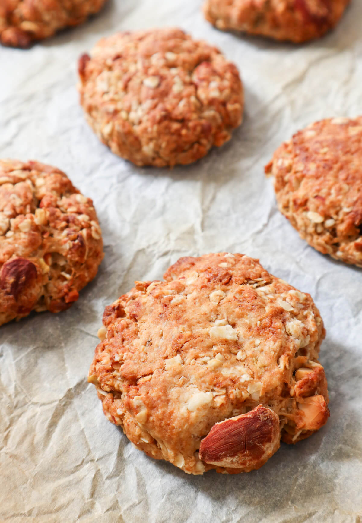 baked oatmeal almond cookies on parchment paper