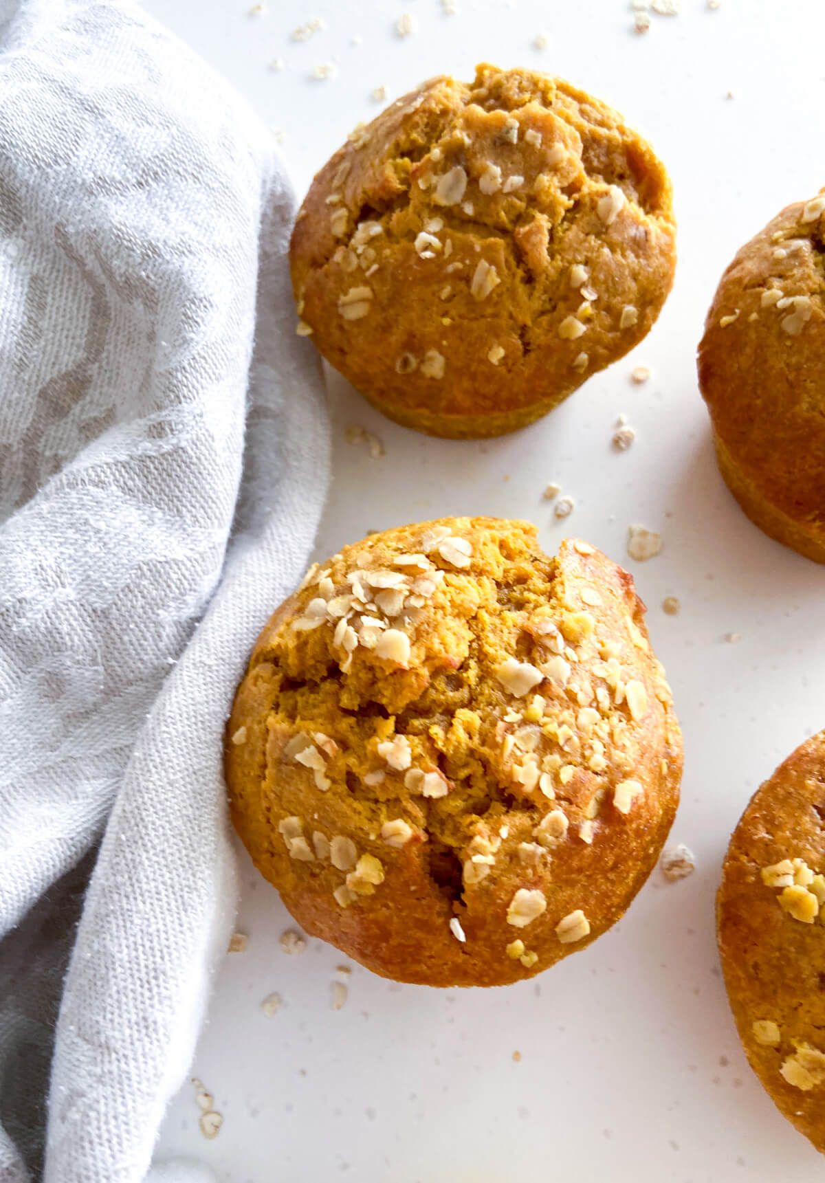 Baked muffin with oats on top.
