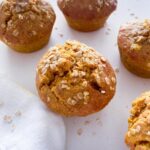 Close up of the baked muffins sprinkled with oats.
