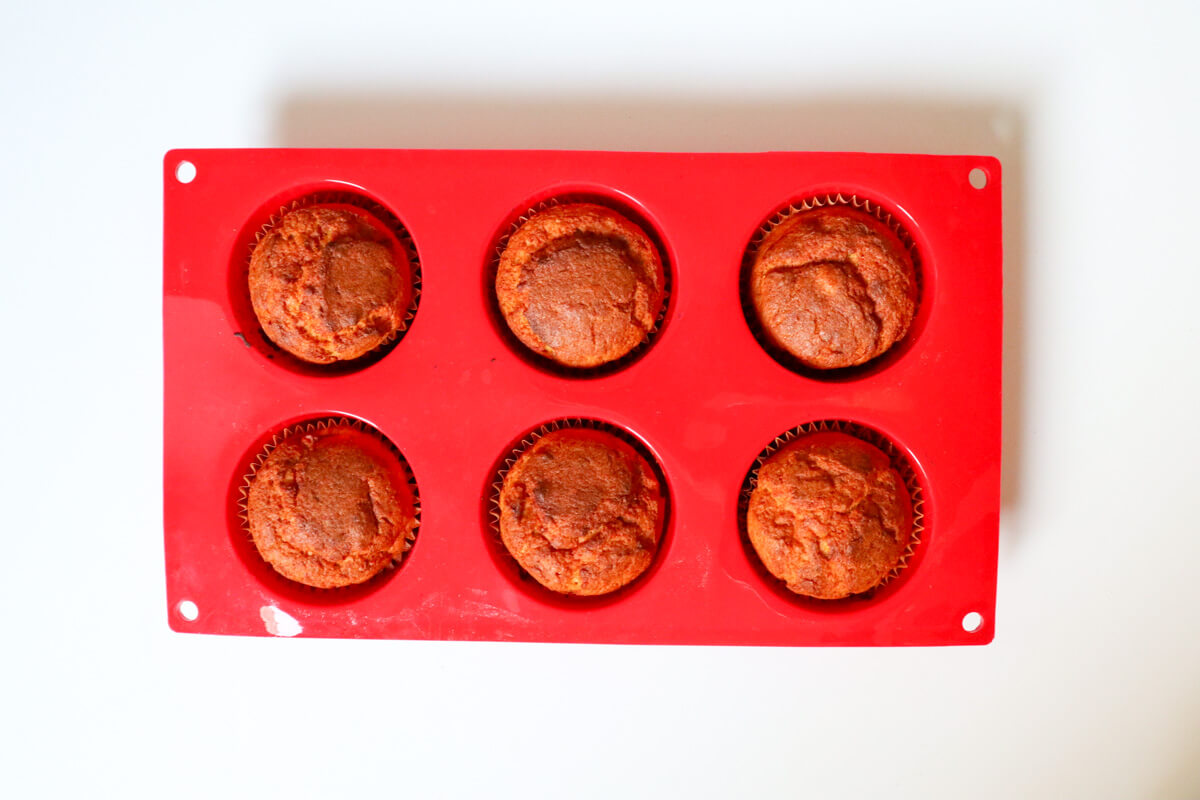 Baked muffins in a silicone muffin pan.