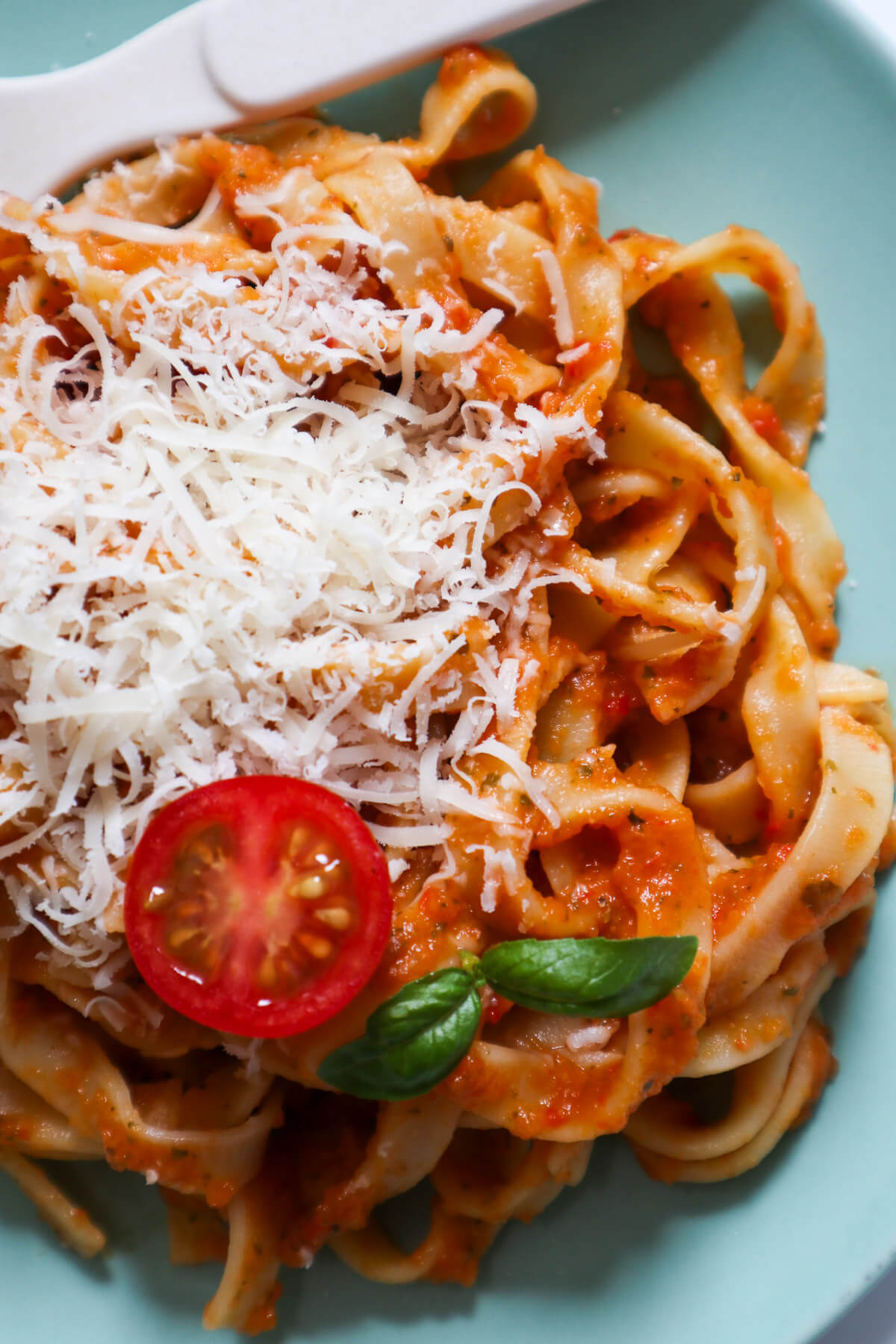 Linguini topped with the hidden vegetable pasta sauce, tomatoes, cheese and fresh basil.