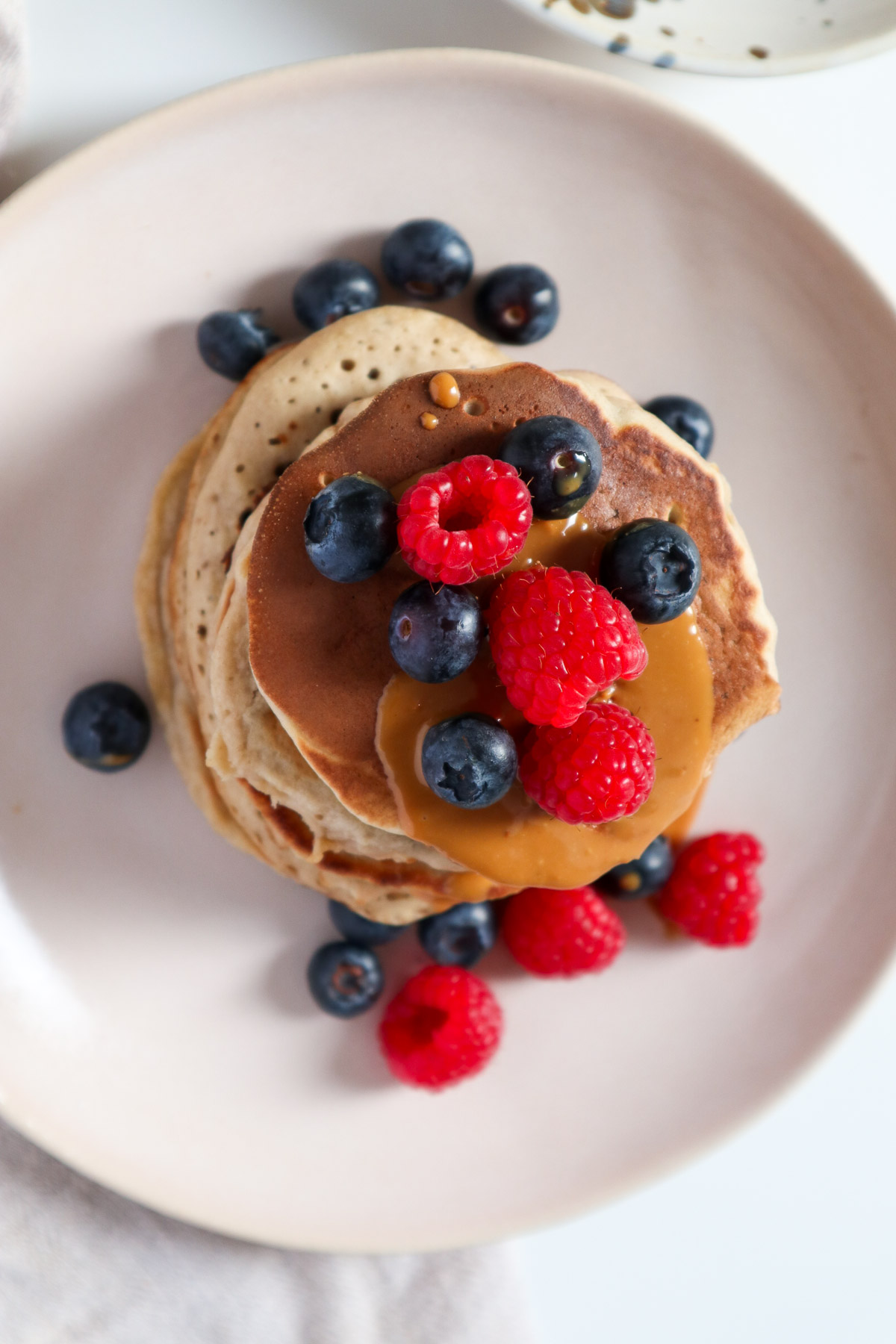 Top down view of stacked buckwheat pancakes.