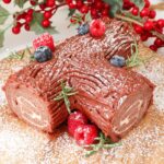 Chocolate Yule log topped with berries