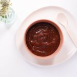 Prune puree in a kids bowl.