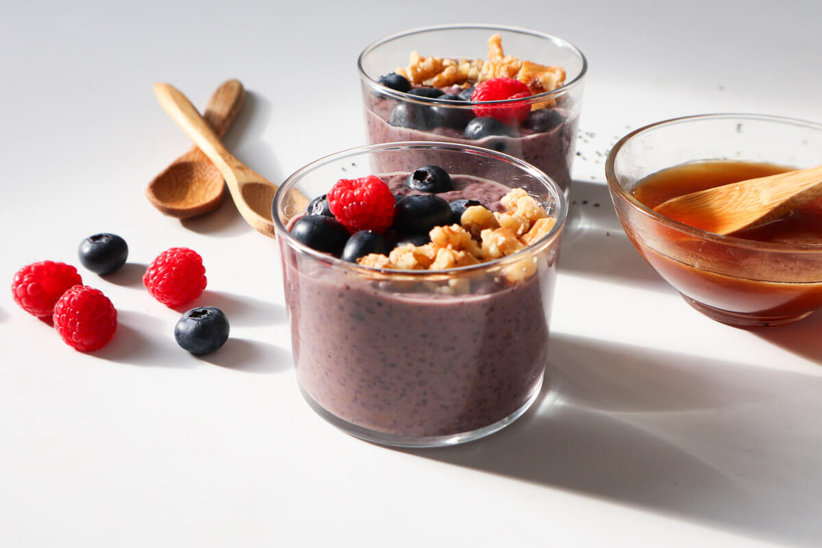 Blueberry Chia Pudding topped with berries and walnuts.