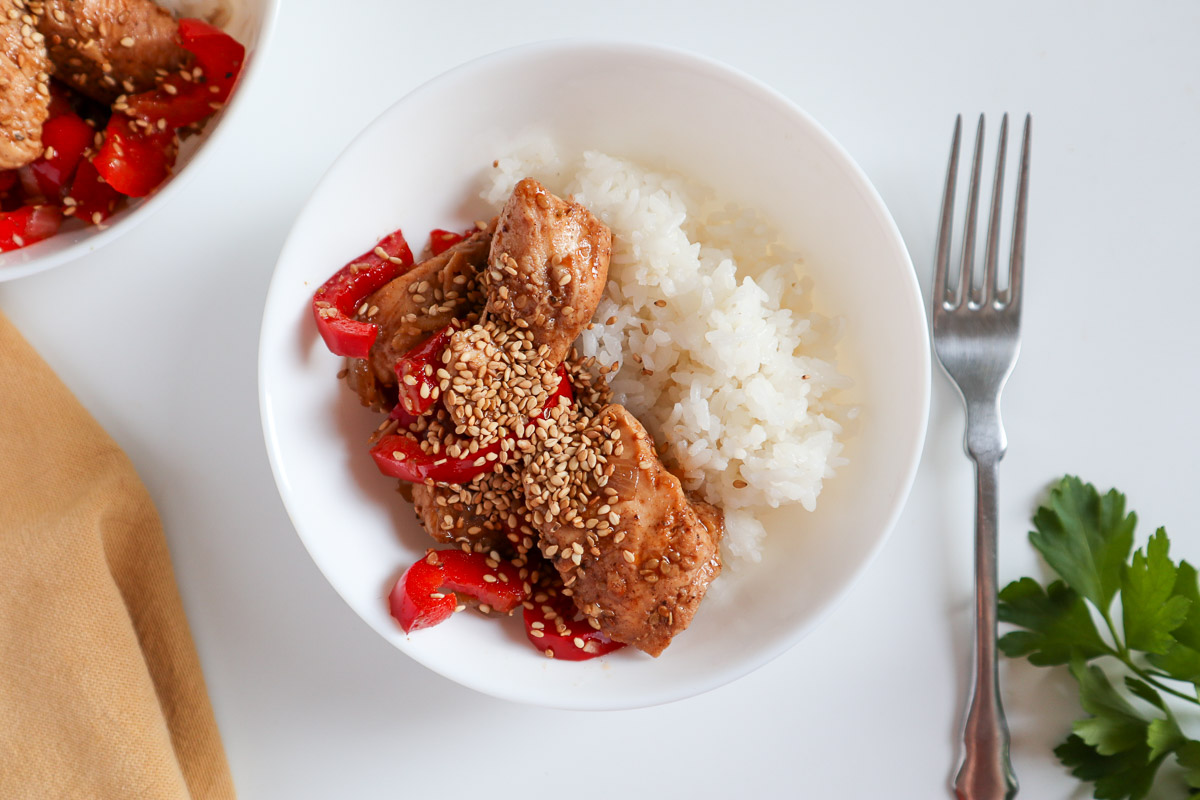 Chinese salt and pepper chicken with rice in a white bowl