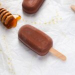 Homemade Vegan Nutella ice cream popsicle on white background