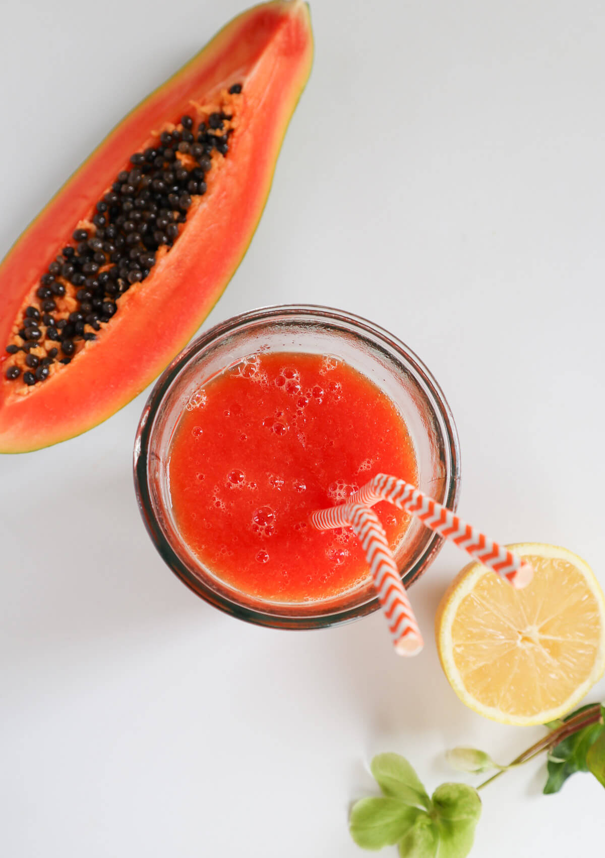 papaya juice from top down view in a glass.